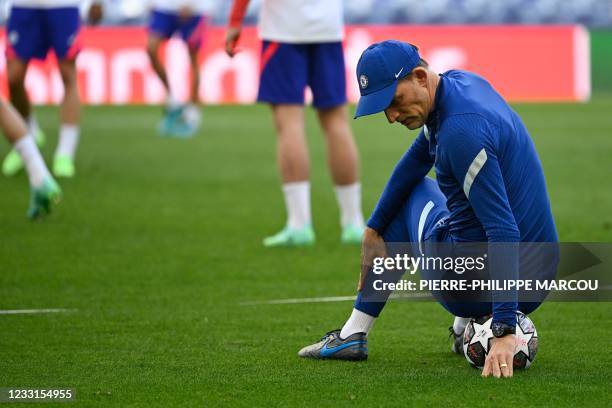 Chelsea's German coach Thomas Tuchel sits on a ball during a training session at the Dragao stadium in Porto on May 28, 2021 on the eve of the UEFA...