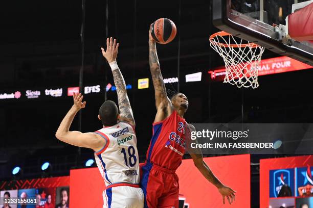 Moscow's Will Clyburn takes a shot next to Anadolu Efes Istanbul's Adrien Moerman during the Basketball Euroleague Final Four championship semi-final...