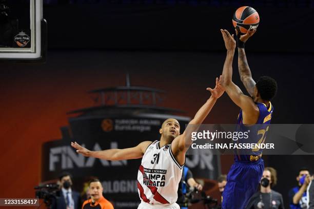 Barcelona's Cory Higgins takes a shot to make the decisive score past Milan's Shavon Shields during the Basketball Euroleague Final Four championship...