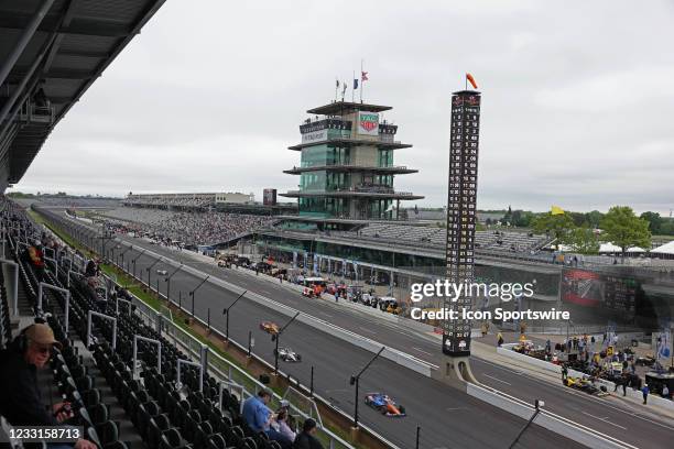 Indy Car Series driver Scott Dixon leads a pack of cars down the front straightaway during Miller Lite Carb Day as teams prepare for the 105th...