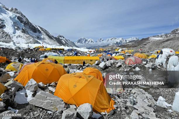 This photograph taken on May 3, 2021 shows expedition tents at Everest Base Camp in the Mount Everest region of Solukhumbu district. - The warmer...