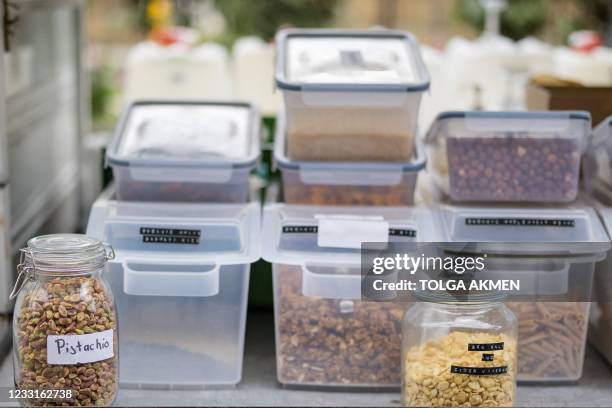 Dry foods in jars are pictured on the Topup Truck, an electric milk float converted into a zero waste shop which brings "packaging-free" shopping to...