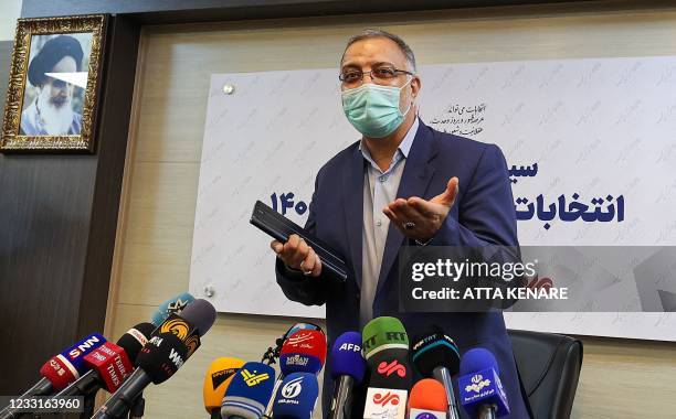 Iranian presidential candidate Alireza Zakani gestures ahead of a press conference at the Mehr News Agency in the capital Tehran, on May 29, 2021. -...