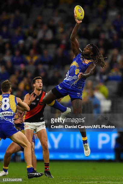 Nic Naitanui of the Eagles contest at a ruck during the 2021 AFL Round 11 match between the West Coast Eagles and the Essendon Bombers at Optus...