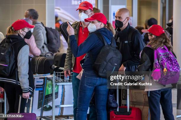 Employees of the Russian embassy in Prague and their families arrive to board a Russian government plane along with expelled Russian diplomats at...