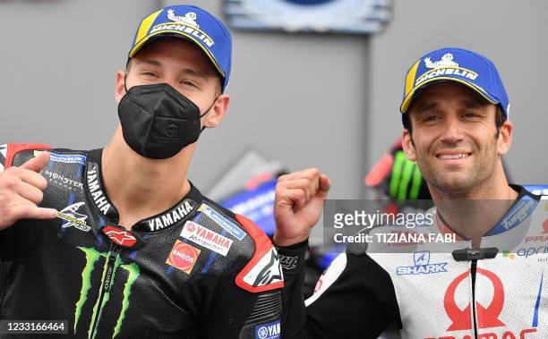 Racing French riders Johann Zarco and Fabio Quartararo react in the pits after the qualifying sessions ahead the Italian Moto GP Grand Prix at the...