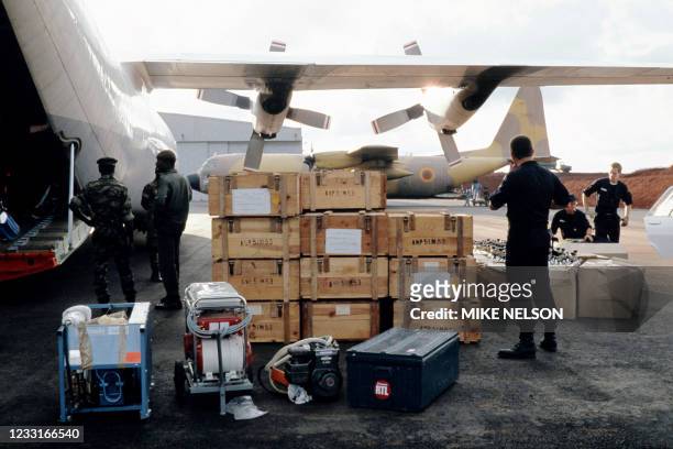Cameroon army soldiers unload international aid at Bamenda airport on August 29, 1986 for victims and displaced people affected by the volcanic gas...