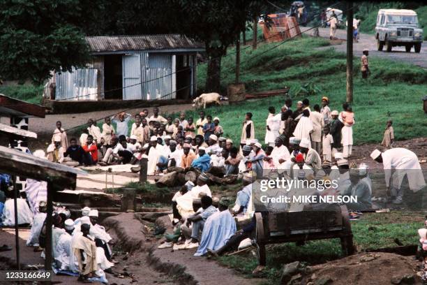 People who fled the gas disaster area around lake Nyos are gathered at Wum catholic mission on August 29, 1986 after the explosion of the volcanic...