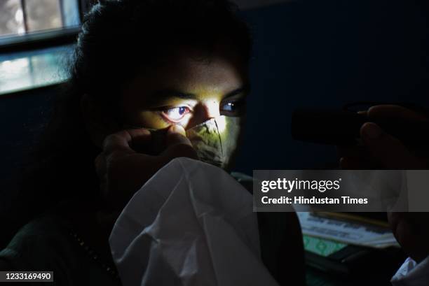 An eye doctor does a routine check-up of the eyes of Covid-recovered patients for any symptoms of Mucormycosis or Black Fungus as a precautionary...