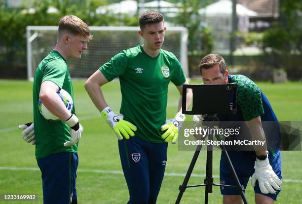 Marbella , Spain - 29 May 2021; Goalkeeping coach Rene Gilmartin reviews a video with goalkeepers Dan Rose and Sam Blair, left, during a Republic of...