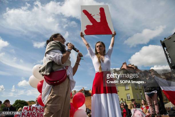 Jana Shostak ,the famous activist holds a placard of victory during the demonstration. In Warsaw, Belarusians living in Poland and Poles gathered to...