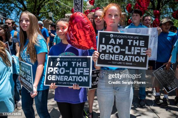 Pro-life protesters stand near the gate of the Texas state capitol at a protest outside the Texas state capitol on May 29, 2021 in Austin, Texas....