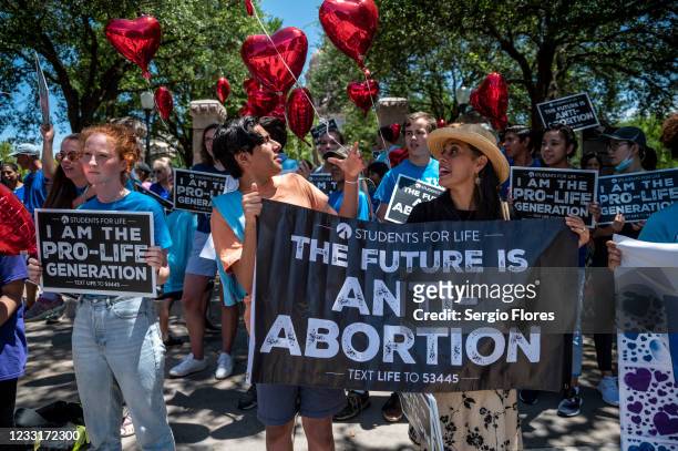 Pro-life protesters stand near the gate of the Texas state capitol at a protest outside the Texas state capitol on May 29, 2021 in Austin, Texas....