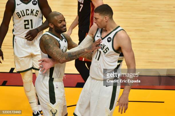 Tucker of the Milwaukee Bucks celebrates with Brook Lopez during the fourth quarter against the Miami Heat in Game Four of the Eastern Conference...