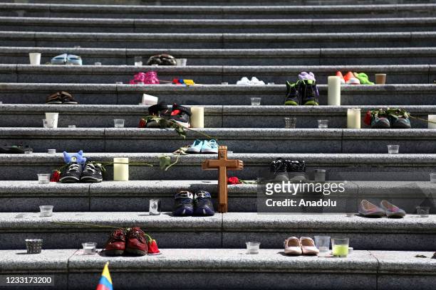People gather outside Vancouver Art Gallery, where 215 pairs of kids shoes displayed on May 29, 2021 in Vancouver, British Columbia, Canada The...