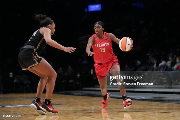 Tiffany Hayes of the Atlanta Dream handles the ball against the New York Liberty on May 29, 2021 at Barclays Center in Brooklyn, New York. NOTE TO...