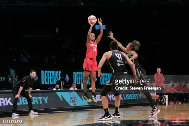 Courtney Williams of the Atlanta Dream shoots the game winning 3-pointer during the game against the New York Liberty on May 29, 2021 at Barclays...