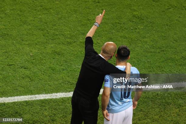 Pep Guardiola the manager / head coach of Manchester City gives instructions Sergio Aguero of Manchester City during the UEFA Champions League Final...