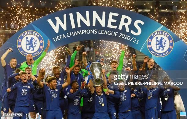 Chelsea's Spanish defender Cesar Azpilicueta celebrates with the trophy after winning the UEFA Champions League final football match at the Dragao...