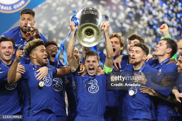 Players of Chelsea celebrate with the trophy at the end of the UEFA Champions League final match against Manchester City at Dragao Stadium on May 29,...