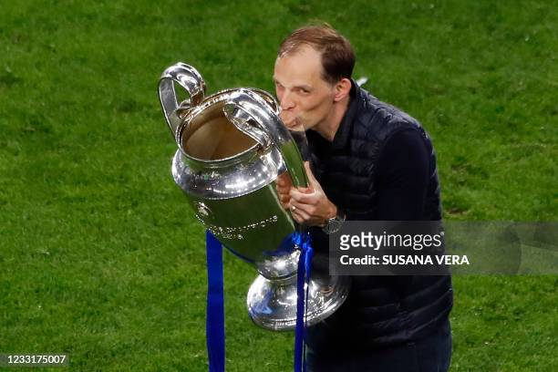 Chelsea's German coach Thomas Tuchel celebrates with the trophy after winning the UEFA Champions League final football match at the Dragao stadium in...