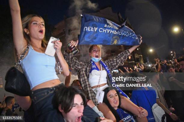Chelsea supporters celebrate in streets surrounding Chelsea's Stamford Bridge stadium in London, after Chelsea beat Manchester City to win the UEFA...