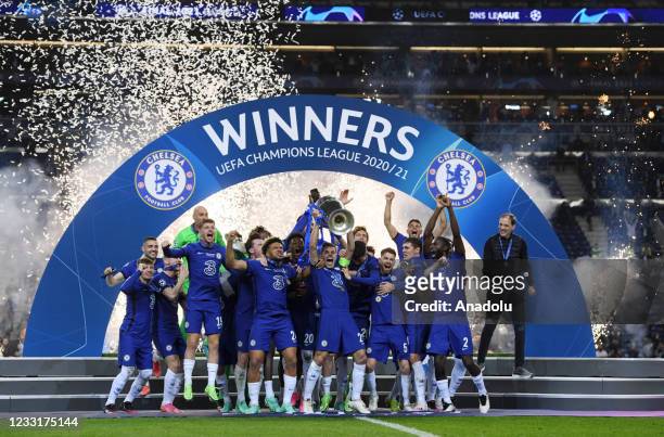 Players of Chelsea celebrate with the trophy at the end of the UEFA Champions League final match against Manchester City at Dragao Stadium on May 29,...