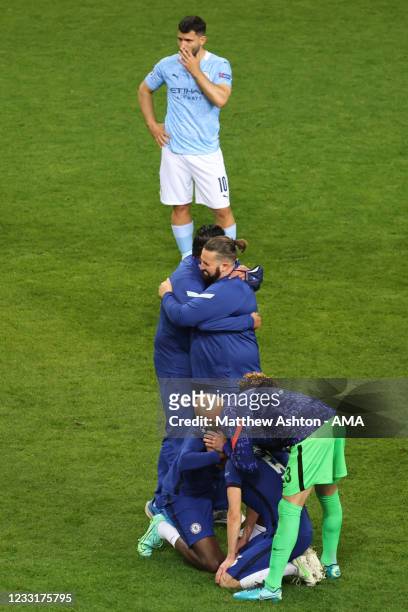 Dejected Sergio Aguero of Manchester City looks on as players of Chelsea clebrrta during the UEFA Champions League Final between Manchester City and...