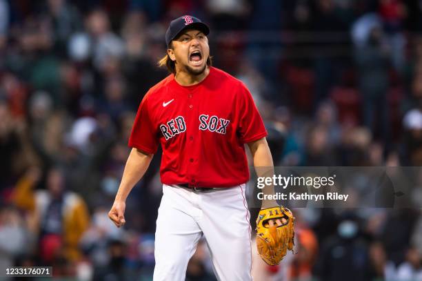 Hirokazu Sawamura of the Boston Red Sox reacts after a strikeout in the eighth inning against the Miami Marlins at Fenway Park on May 29, 2021 in...