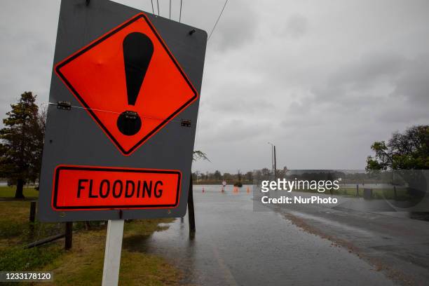 Flood warning sign is seen in New Brighton, Christchurch, New Zealand on May 30, 2021. MetService has put in place code red severe weather warning...