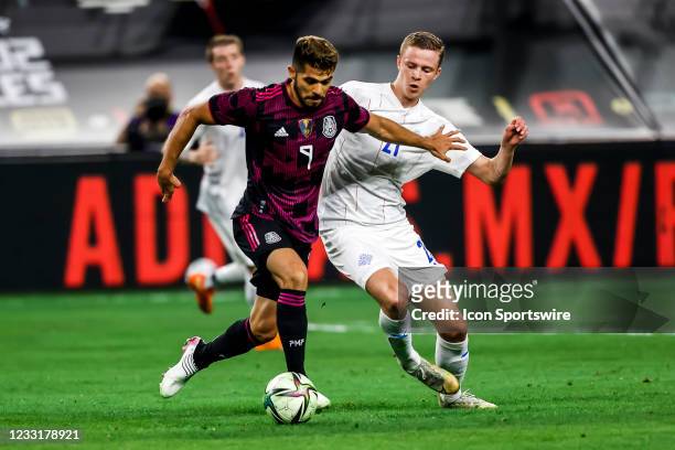 Mexico forward Henry Martin and Iceland defender Brynjar Ingi Bjarnason battle for the ball during the game between Mexico and Iceland on May 29,...