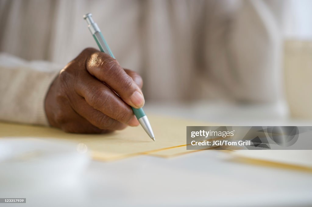 Black woman writing letter