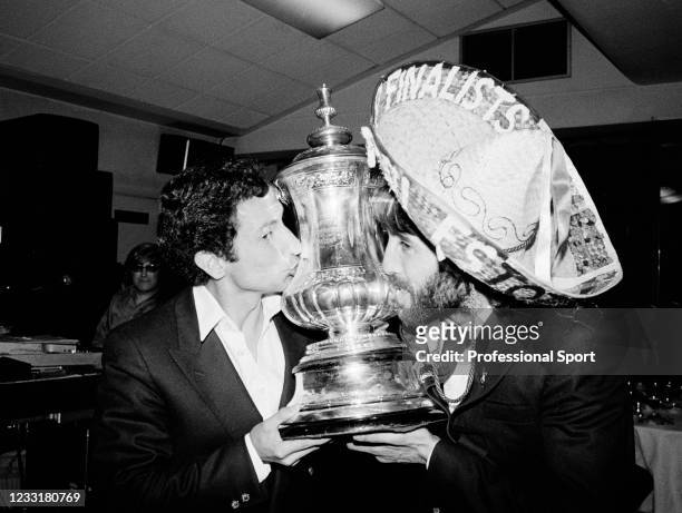 The scorer of the winning goal for Tottenham Hotspur, Ricardo Villa celebrates with his Argentinian teammate Ossie Ardiles, and the FA Cup, at the...