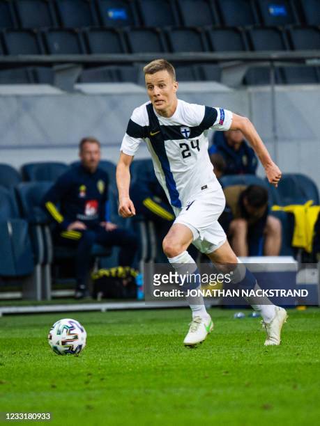 Finland's defender Robert Ivanov controls the ball during the international friendly football match between Sweden and Finland at the Friends Arena...