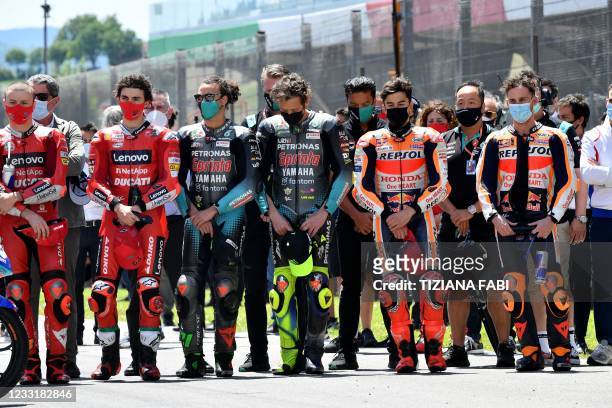 Riders observe a minute of silence in tribute to Swiss Moto3 rider Jason Dupasquier who died aged 19 from injuries sustained in a crash in qualifying...