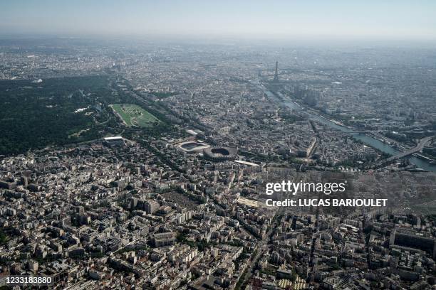 This aerial photograph taken on May 30, 2021 shows the Bois de Boulogne, The Auteuil Hippodrome, Jean Boin Stadium, Parc des Princes stadium, the...