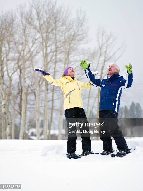 caucasian couple enjoying snow - telluride snowshoe stock pictures, royalty-free photos & images