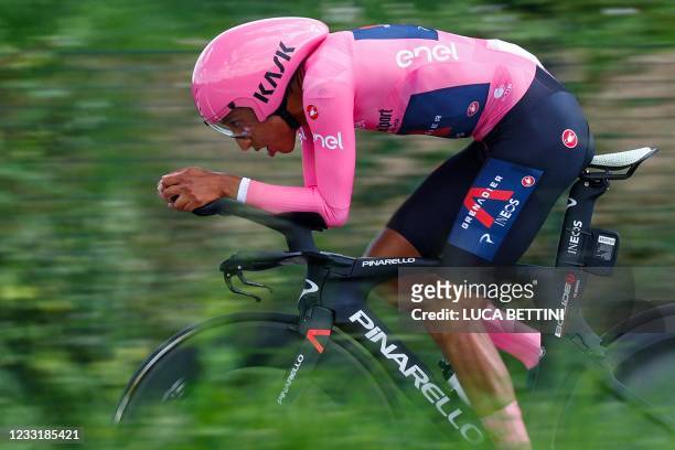 Overall leader Team Ineos rider Colombia's Egan Bernal rides during the 21st and last stage of the Giro d'Italia 2021 cycling race, a 30.3km...