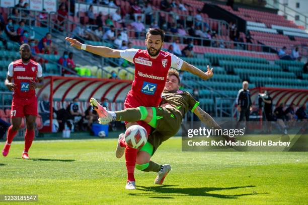 Matteo Tosetti of FC Sion battles for the ball with Dominik Schwizer of FC Thun during the Super League Barrage game between FC Sion and FC Thun at...