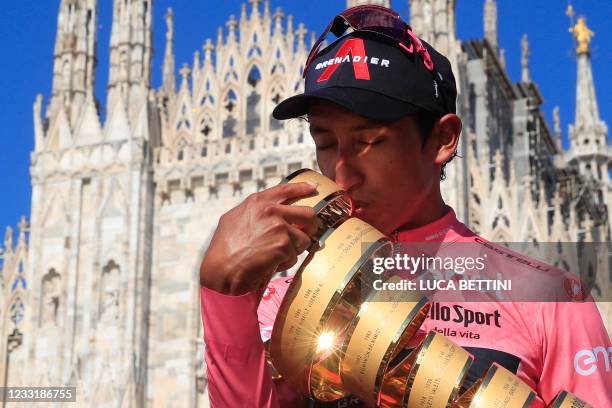 Team Ineos rider Colombia's Egan Bernal kisses the race's Trofeo Senza Fine on the podium after winning the Giro d'Italia 2021 cycling race following...