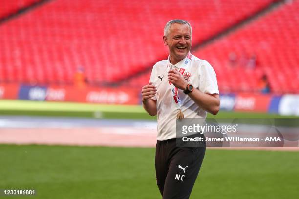 Neil Critchley the head coach / manager of Blackpool smiles after having champagne poured over him during the Sky Bet League One Play-off Final match...