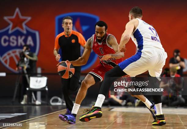 Moscow's Johannes Voigtmann and Milan's Kevin Punter vie for the ball during the Basketball Euroleague Final Four championship third place match...