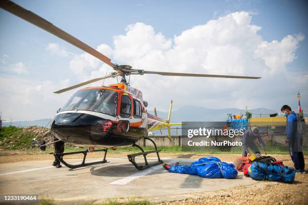 Image depicts death) The body of an American mountaineer Puwei Liu who died during his descent from Mount Everest lies on the ground after being...