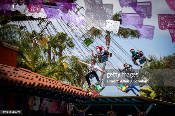 Buena Park, CA Park-goers ride the Wave Swinger ride during the re-opening day at Knott's Berry Farm to the full public and celebrate the 100th...