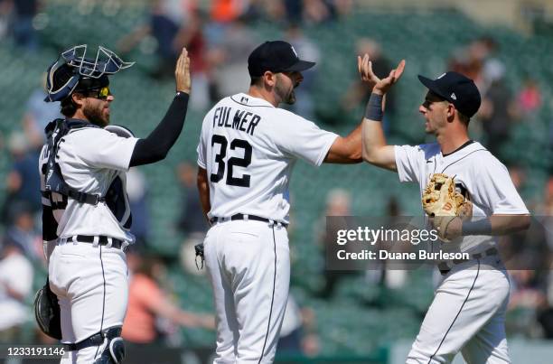 Catcher Eric Haase of the Detroit Tigers celebrates with pitcher Michael Fulmer and shortstop Zack Short after a 6-2 win over the New York Yankees at...