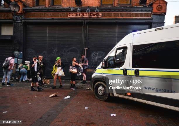 Members of Gardai enforce coronavirus restrictions and move people from South William Street in Dublin. The chief medical officer, Dr. Tony Holohan...