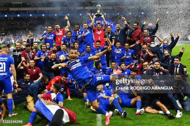 Cruz Azul's captain Jesus Corona and teammates celebrate with the trophy after winning the Mexican Clausura final football match against Santos at...