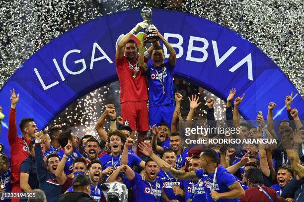 Cruz Azul's captain Jesus Corona and teammates celebrate with the trophy after winning the Mexican Clausura final football match against Santos at...