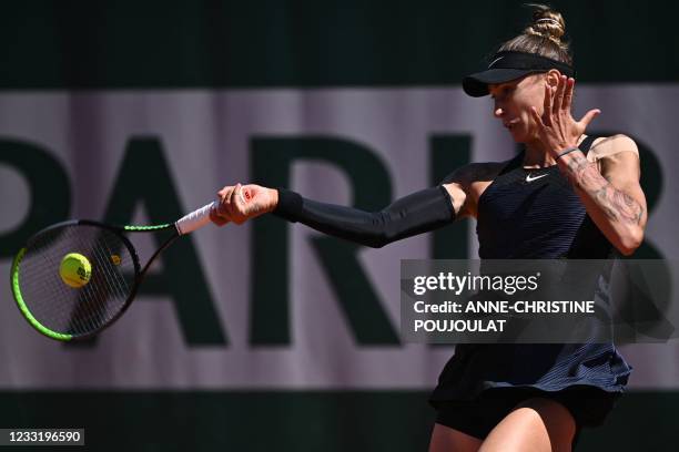 Slovenia's Polona Hercog returns the ball to Netherlands' Kiki Bertens during their women's singles first round tennis match on Day 2 of The Roland...