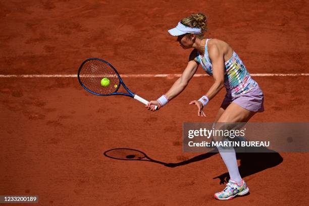 Germany's Laura Siegemund returns the ball to France's Caroline Garcia during their women's singles first round tennis match on Day 2 of The Roland...